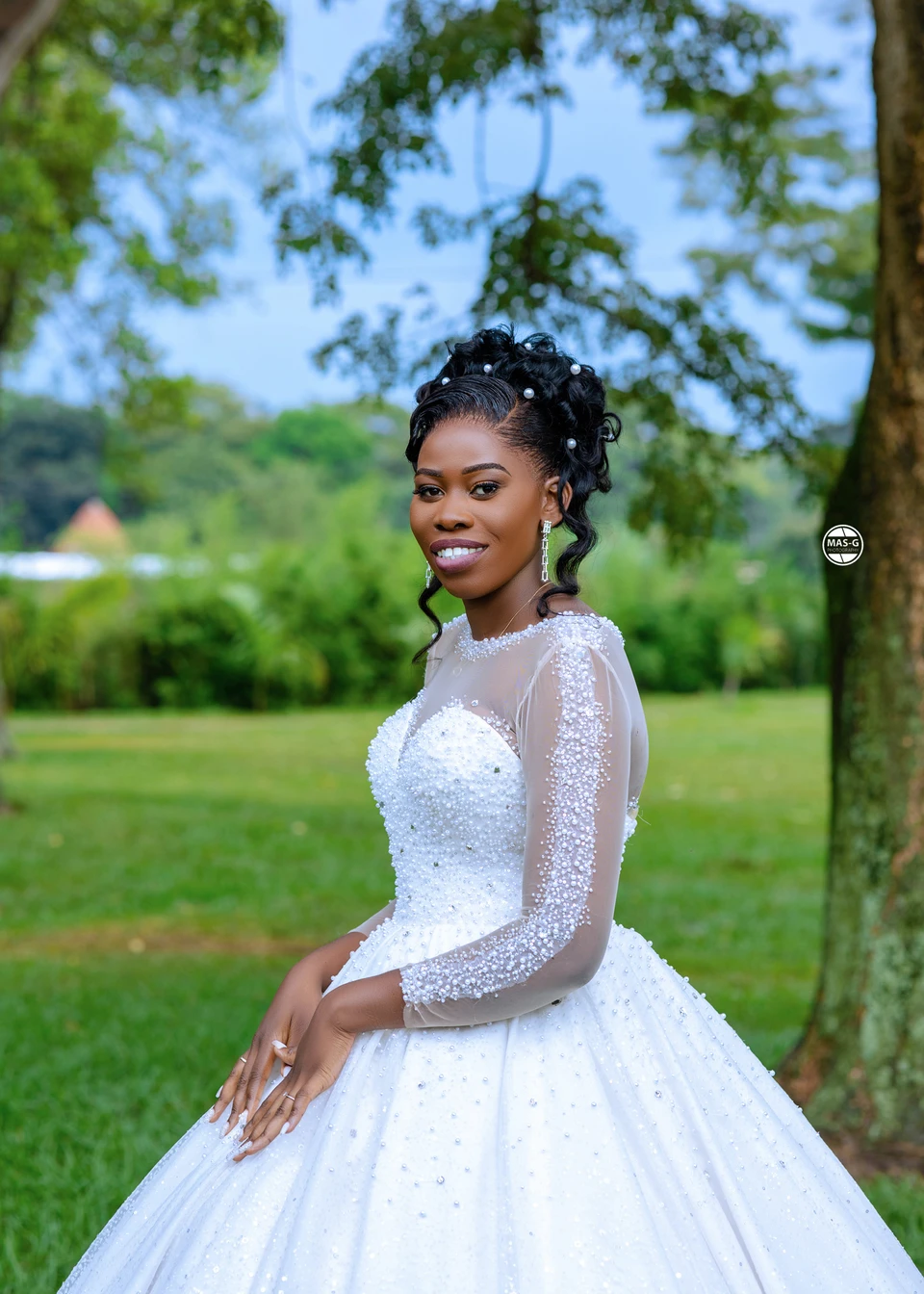 Bride looking over her shoulder in a garden